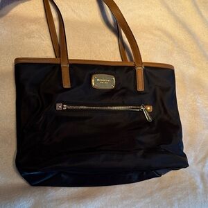 Michael Kors Black Tote with Brown Leather Trim and Gold Plate
